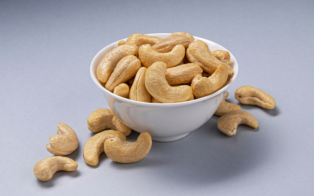 Heap of Cashew Nuts in a White Bowl 